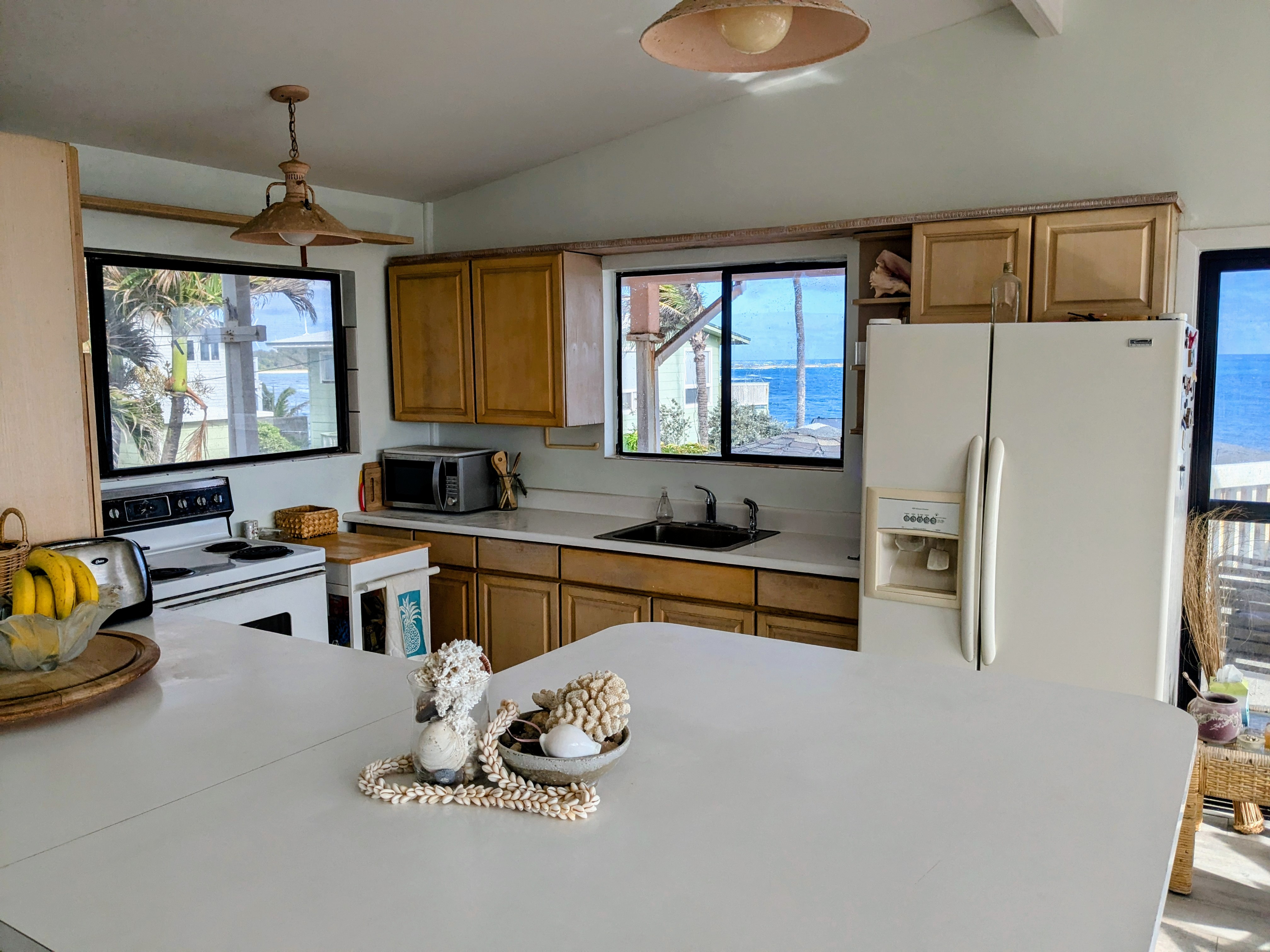 Kitchen with ocean view through windows