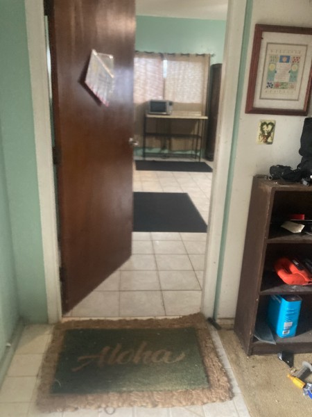 Dining area with tropical chairs and candle