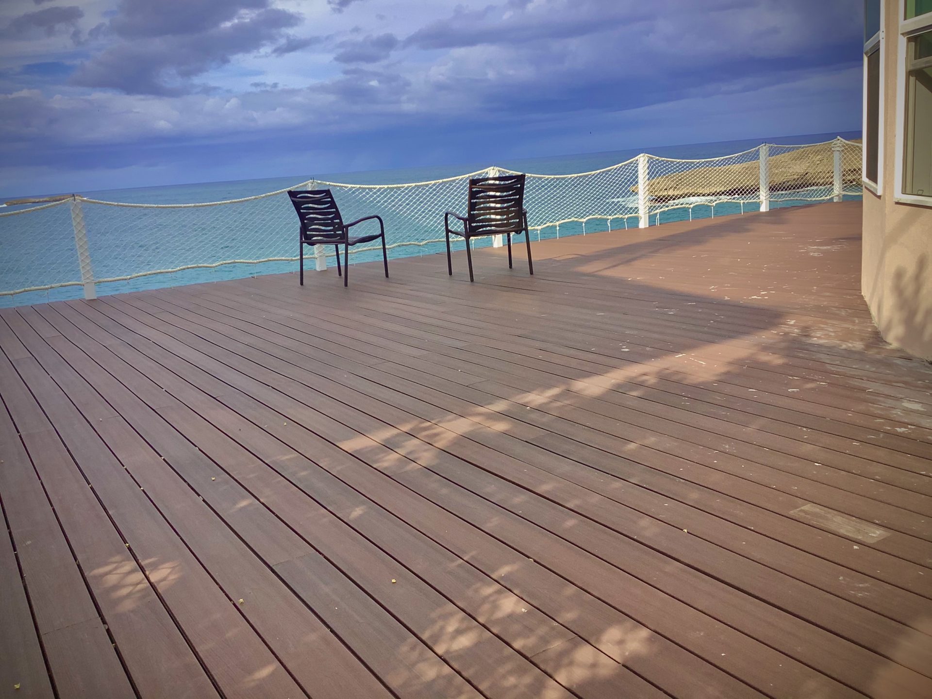 Oceanfront deck with two chairs