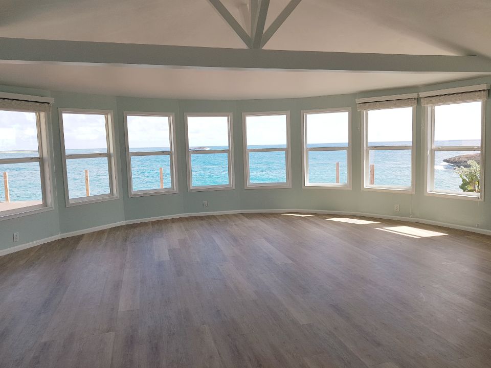 Curved great room with seven ocean-view windows